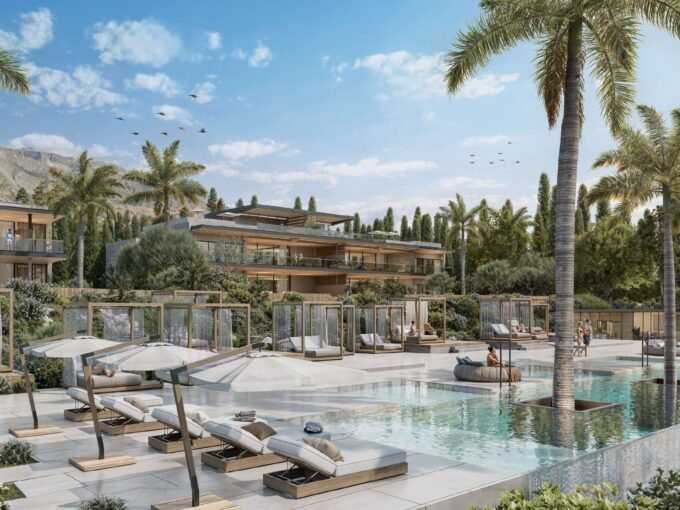 Communal pool with sun terraces and shaded cabanas at Armani Residences Marbella, Nagüeles