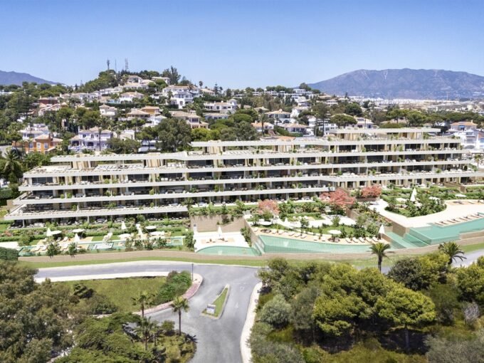 Aerial view of the terraced apartment blocks and landscaped grounds at Arosa, La Cala de Mijas