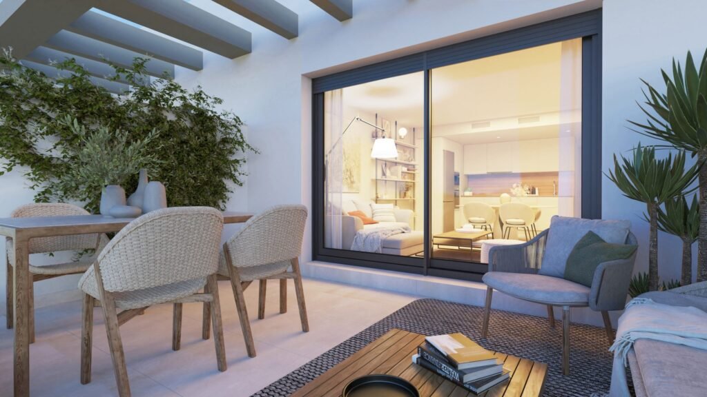 Private terrace opening onto the living room at Célere Delmar II, Mijas