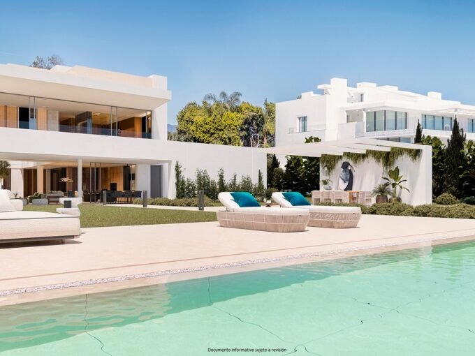South facing facade and infinity pool in daylight at Emare TheVila, Estepona