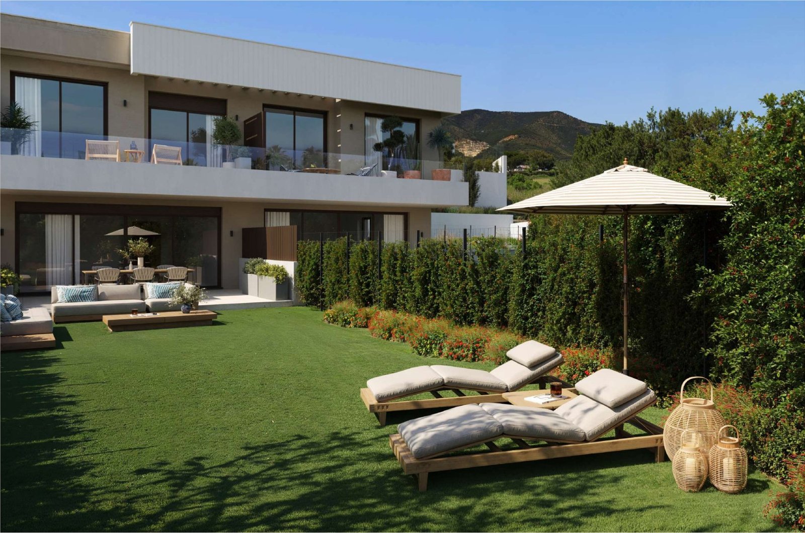 Private garden and rear facade of a townhouse at KALA Residences, Fuengirola