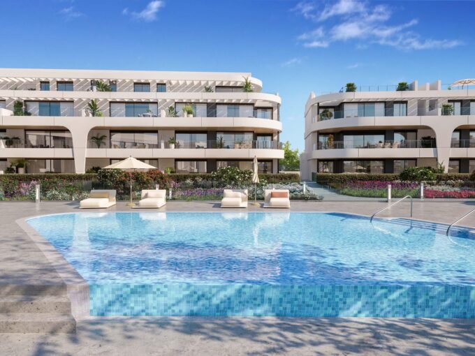 Outdoor swimming pool and apartment blocks at Naya Residences, Estepona