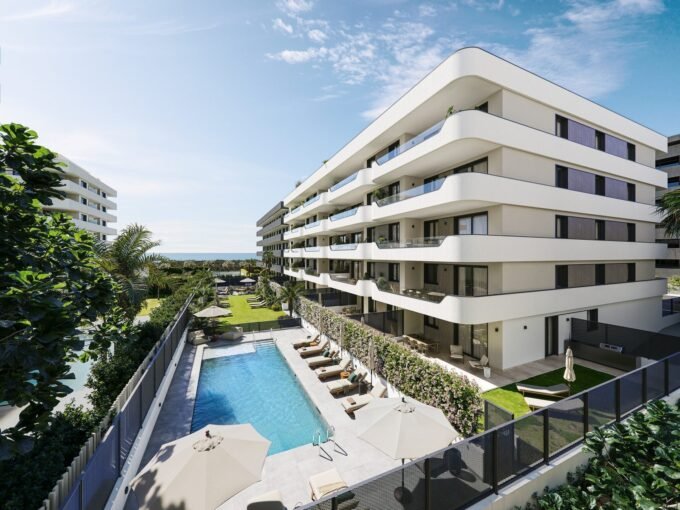 Aerial view of the residential building and communal pool at Azure Living, Torre del Mar
