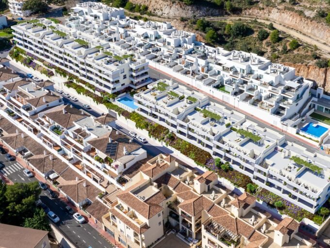 Aerial view of the terraced blocks and the pool at Blossom Hills, Benalmadena