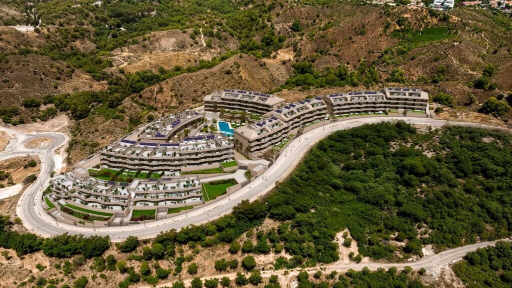 Aerial view of Evoque Residences on the El Higuerón hillside above Fuengirola