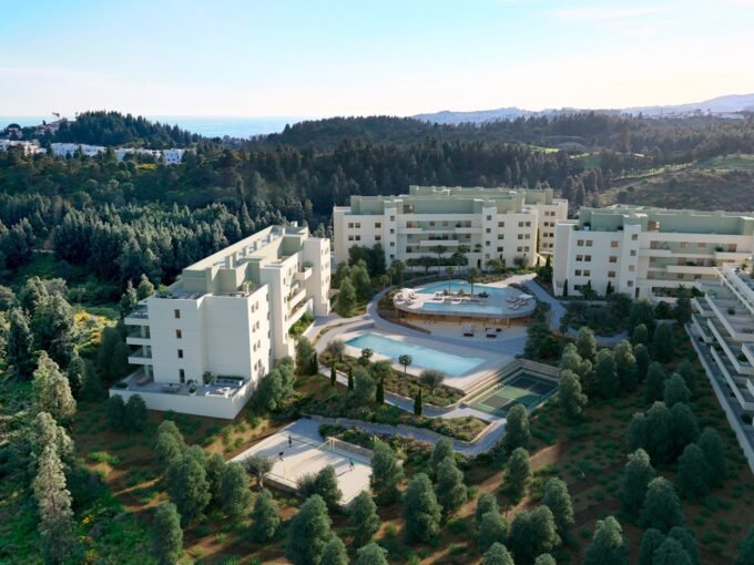 Aerial view of the blocks and communal pools at Greenity, Mijas