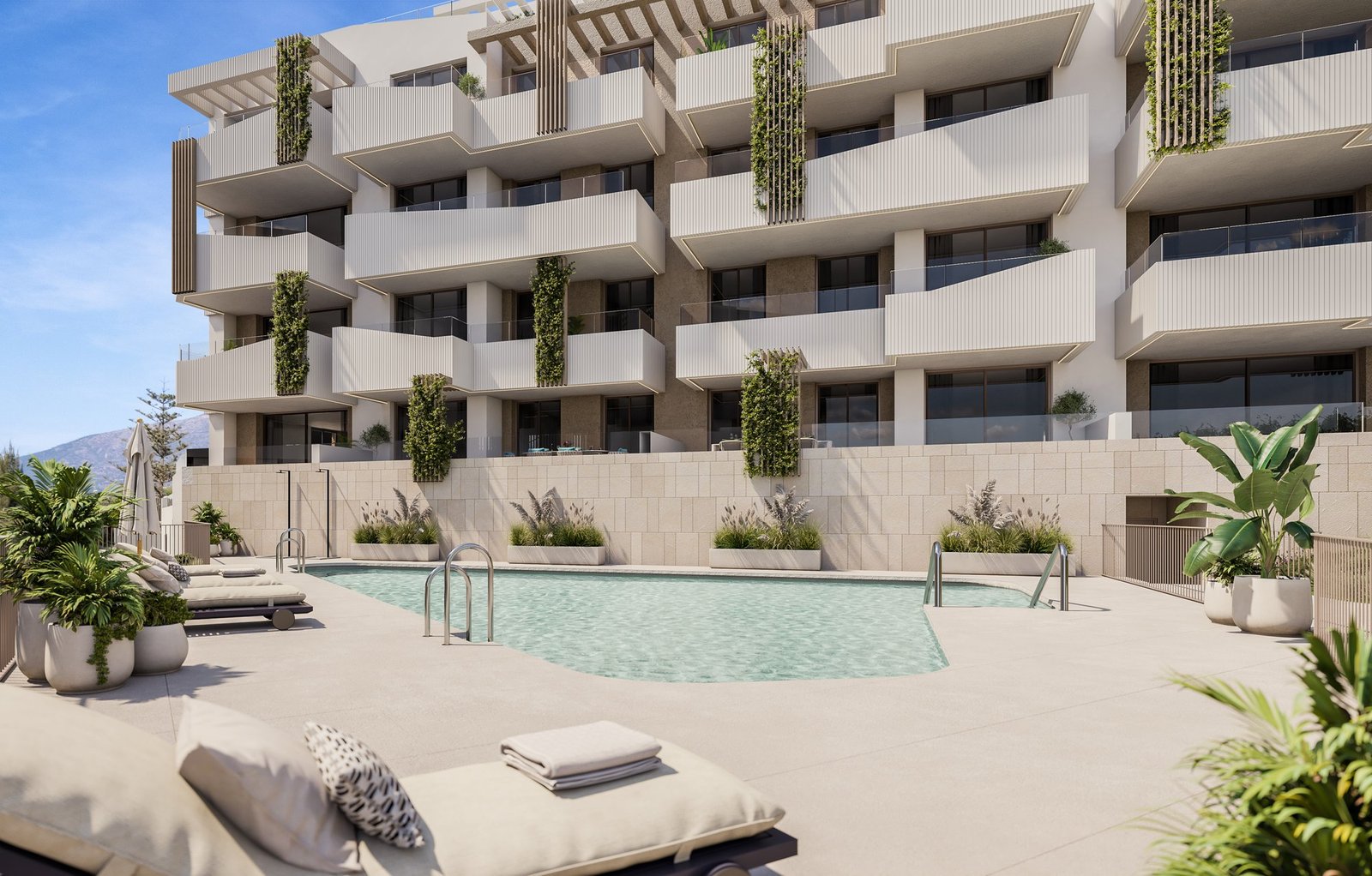 Communal swimming pool and sun terrace at Helvet Green, Mijas Golf