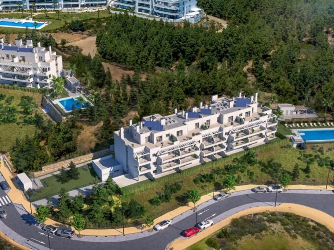 Aerial view of the gated residential complex and its pools at Sunrise, Mijas Costa