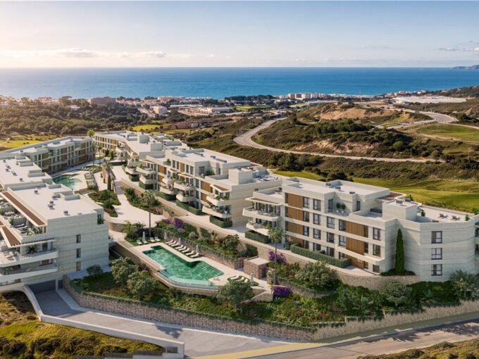 Aerial view of the apartment blocks, gardens and pool, at Kalifornia, Estepona
