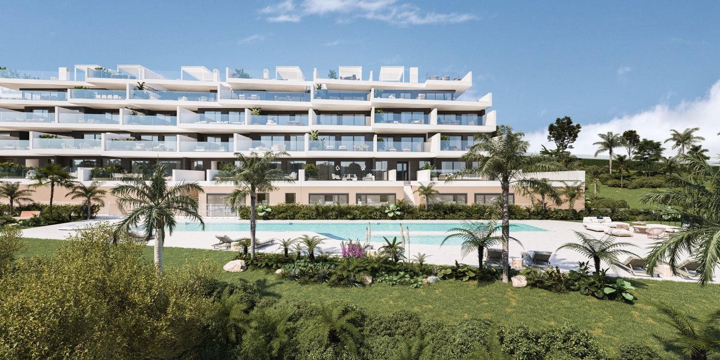Communal pool and gardens in front of the buildings at Pure Sun II, Manilva