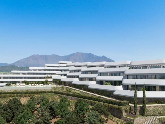 Stepped buildings with terraces facing the coast at Skye Casares Golf, Casares